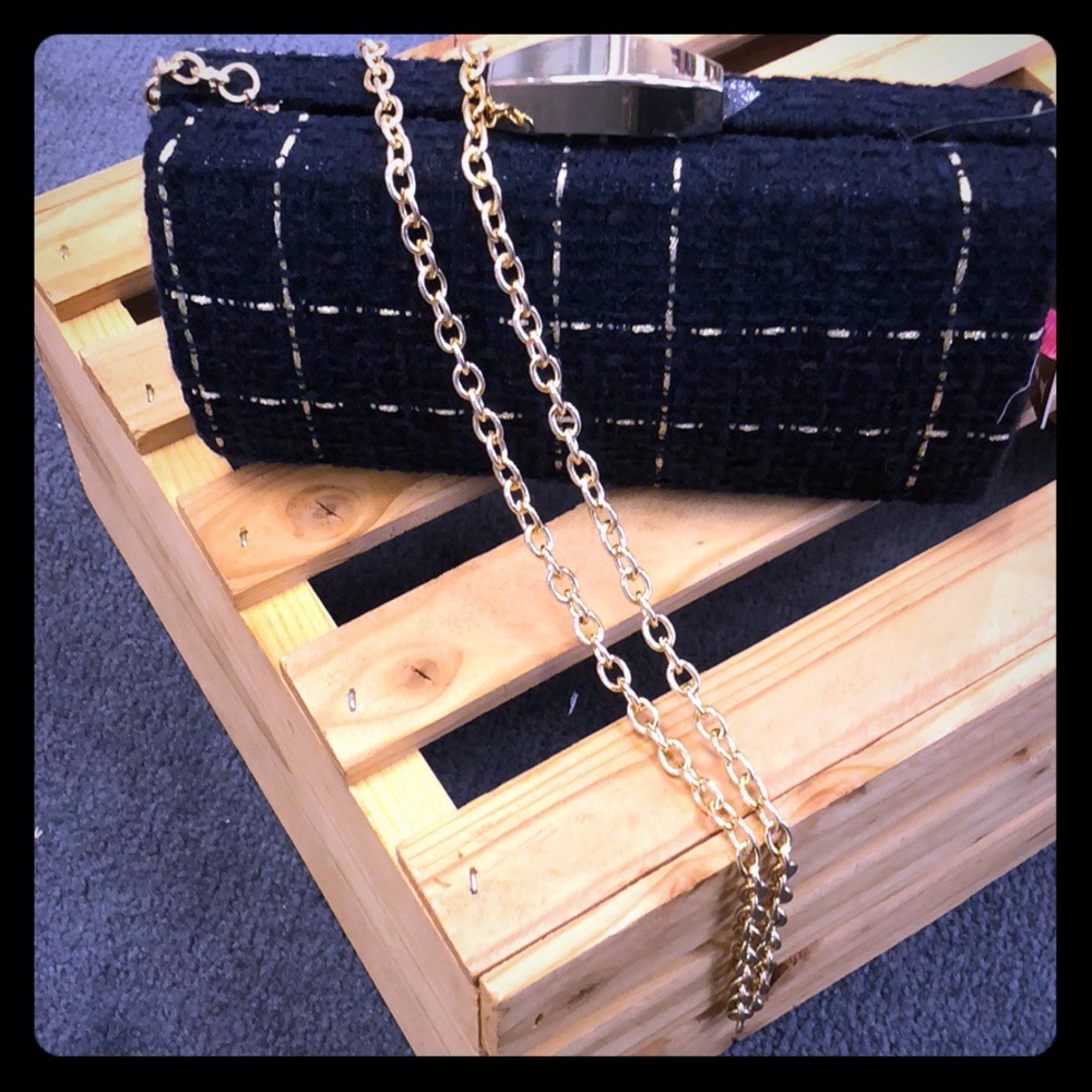 Black knitted clutch with beige stripe design